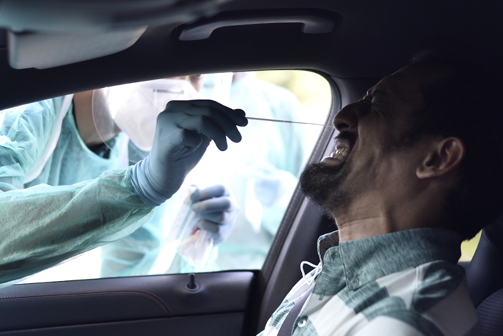 Selcare health officers take samples during a free screening of Covid-19 organised by the Selangor gtate government at Dewan Musa Muda, Shah Alam April 19, 2020. u00e2u20acu201d Picture by Miera Zulyana