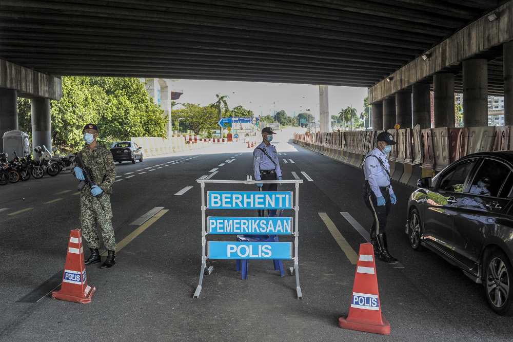 Army and police personnel conducting roadblocks during the movement control order (MCO) in Kuala Lumpur April 19, 2020. u00e2u20acu201d Picture by Shafwan Zaidon