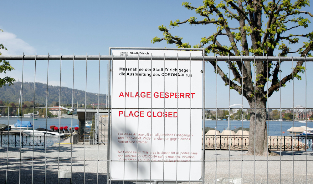 A sign behind a fence warns residents that a lakeside promenade is closed due to health safety measures amid the coronavirus disease (Covid-19) outbreak, in Zurich April 17, 2020.u00c2u00a0u00e2u20acu201d Reuters pic
