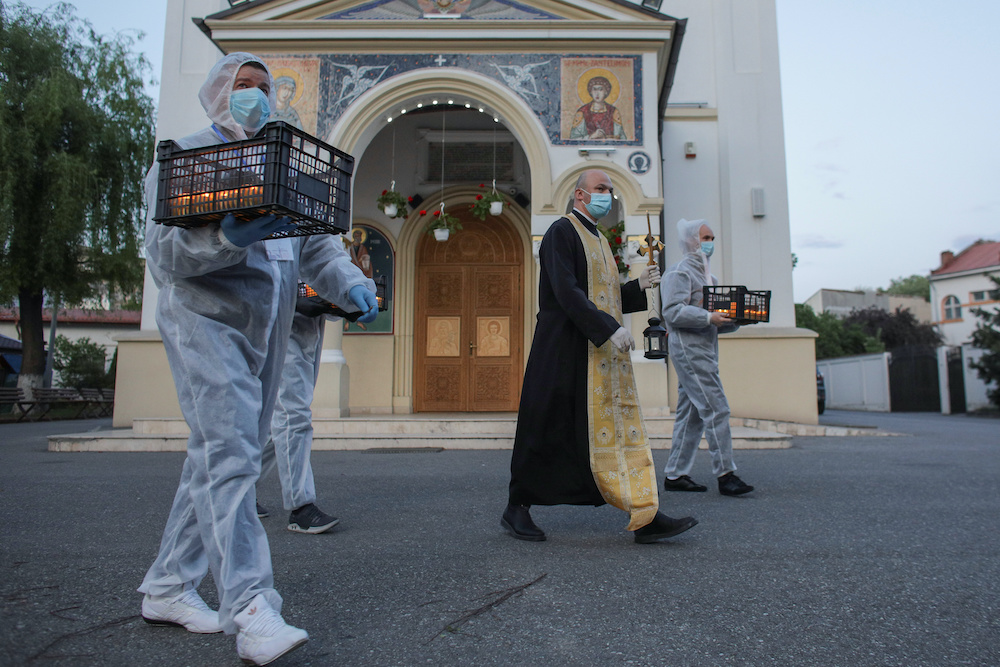 Orthodox priest Bogdan Teleanu, wearing a face masl during the global outbreak of the coronavirus disease (Covid-19), in Bucharest April 18, 2020. u00e2u20acu201d Reuters pic