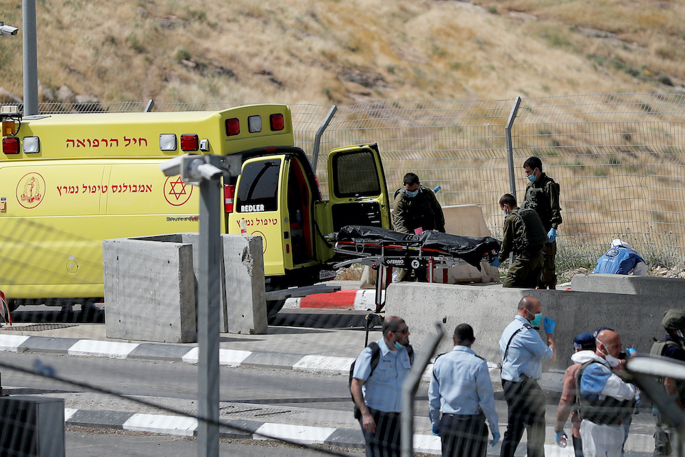 Israeli forces remove the dead body of a Palestinian assailant at the scene of a ramming and stabbing attack near the Jewish settlement of Maale Adumim in the Israeli-occupied West Bank April 22, 2020. u00e2u20acu201d Reuters pic