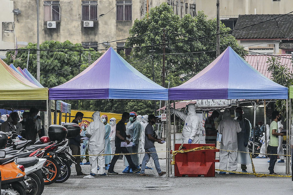 Raja Bot market traders undergoing a screening and swab test at the market, April 30, 2020.
