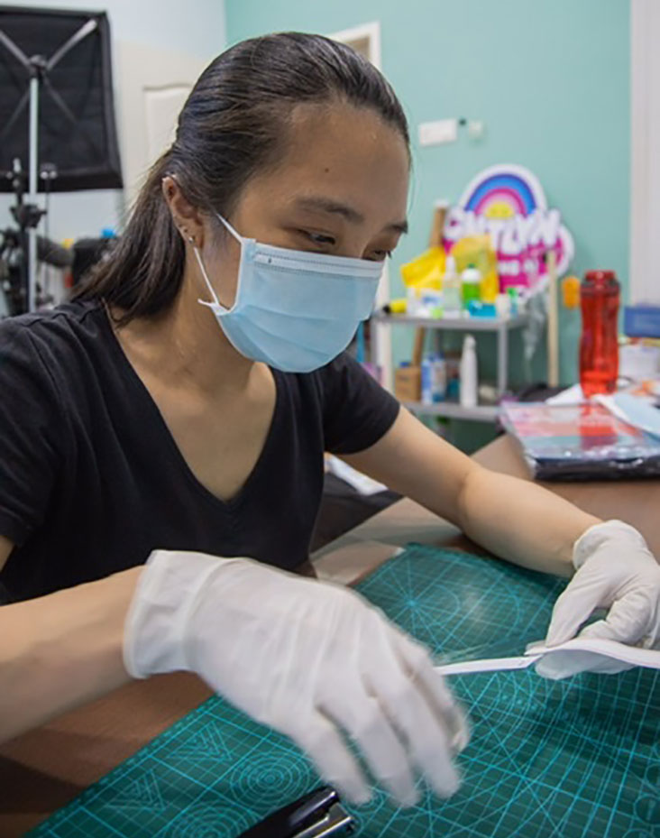 Volunteer making faceshields for Covid-19 frontliners