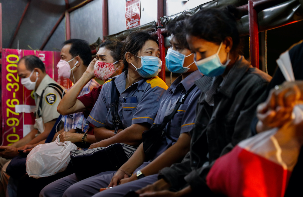Workers wearing protective face masks ride on public transport in Bangkok during the coronavirus disease (Covid-19) outbreak, in Thailand, April 1, 2020. u00e2u20acu201d Reuters picnn
