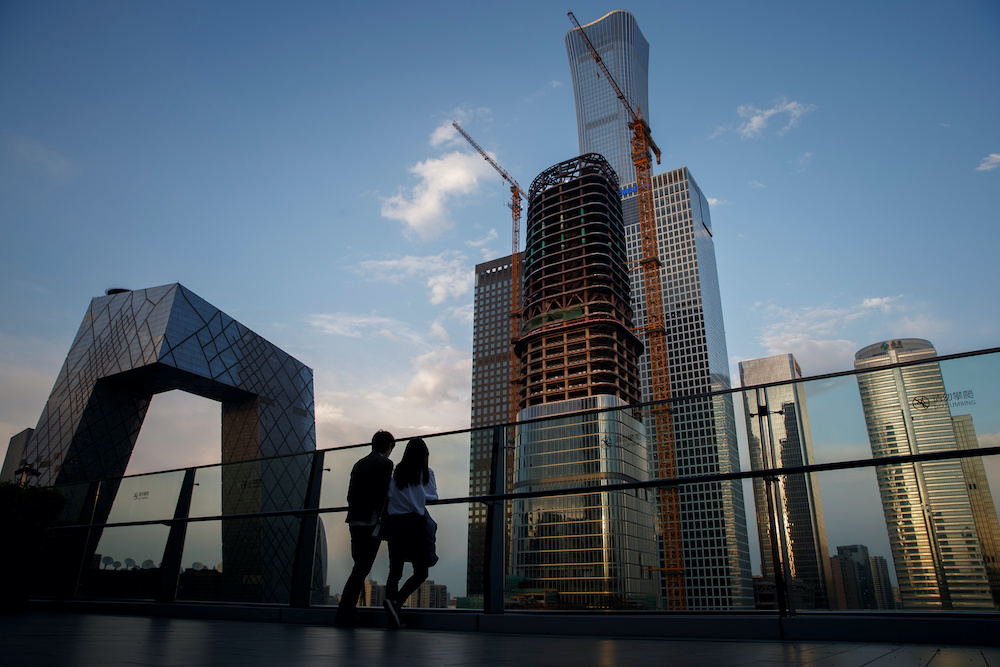 People look at the skyline of the Central Business District in Beijing, China, April 16, 2020. u00e2u20acu2022 Reuters  picnn