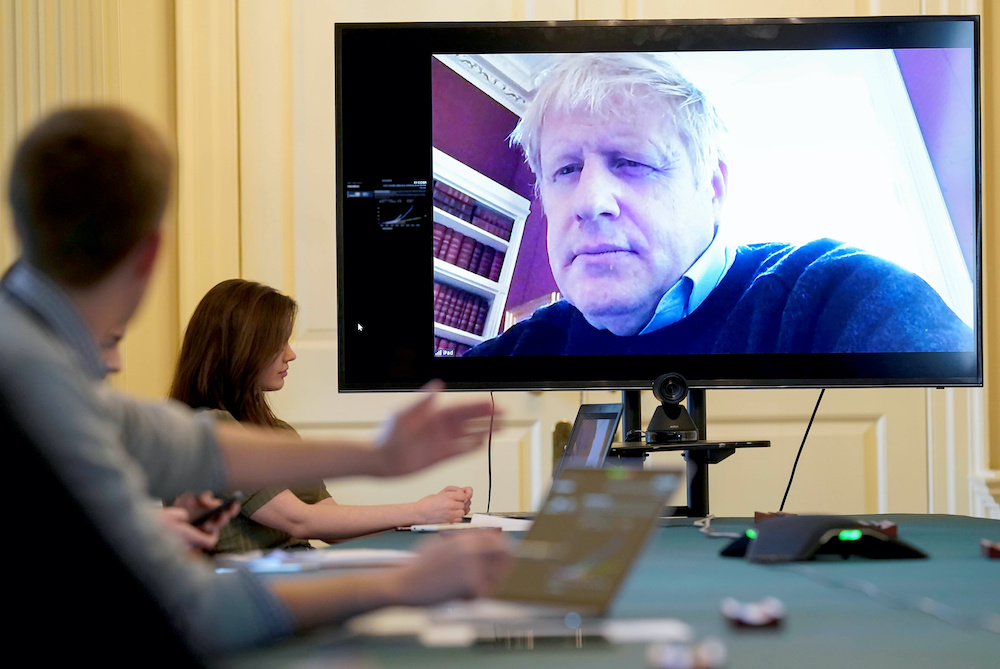 Britainu00e2u20acu2122s Prime Minister Boris Johnson appears on a monitor for the coronavirus disease (Covid-19) meeting in London, Britain March 28, 2020. u00e2u20acu201d Reuters pic