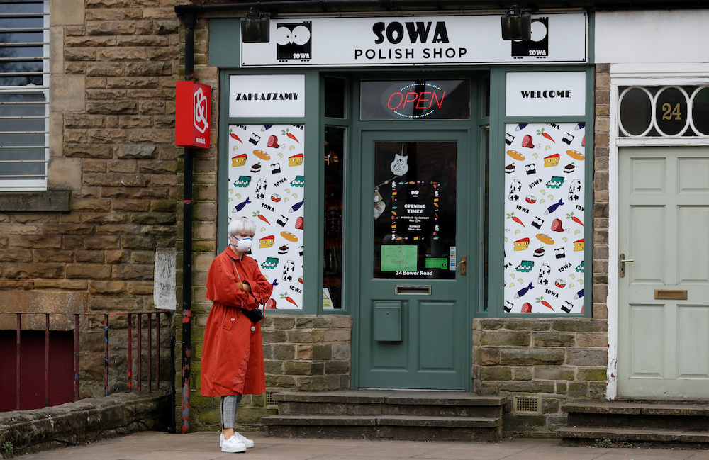 A woman wearing a protective face mask is seen outside a shop in Harrogate, as the spread of the coronavirus disease (Covid-19) continues, Harrogate, Britain, April 1, 2020. u00e2u20acu201d Reuters pic