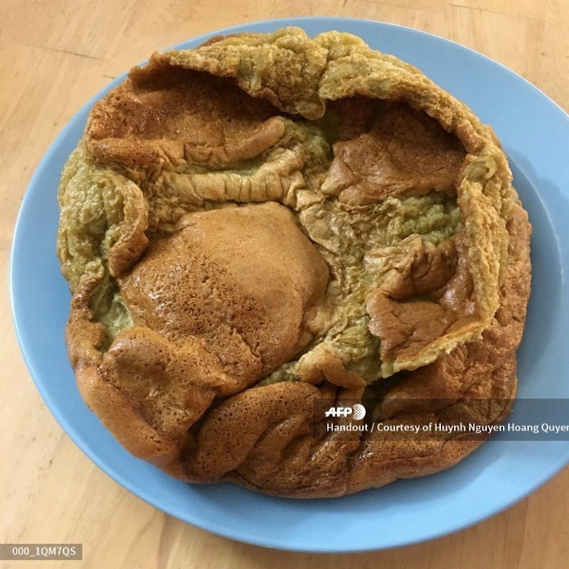 This undated handout image released to AFP on April 15, 2020 courtesy of Huynh Nguyen Hoang Quyen shows a burnt cake she tried to bake at her home in Danang, during restrictions to stay at home as part of measures to halt the spread of the Covid-19 corona