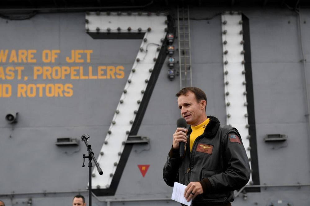 Captain Brett Crozier, commanding officer of the US Navy aircraft carrier USS Theodore Roosevelt, addresses the crew during an all-hands call on the shipu00e2u20acu2122s flight deck in the eastern Pacific Ocean December 19, 2019. u00e2u20acu201d US Navy/Mass Communication Specia