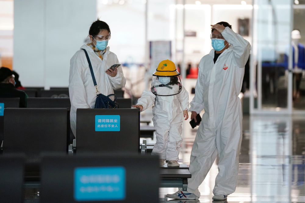 Travellers in protective suits are seen at Wuhan Tianhe International Airport after the lockdown was lifted in Wuhan, the capital of Hubei province and Chinau00e2u20acu2122s  epicentre of the novel coronavirus disease (Covid-19) outbreak, April 10, 2020. u00e2u20acu201d Reuters 
