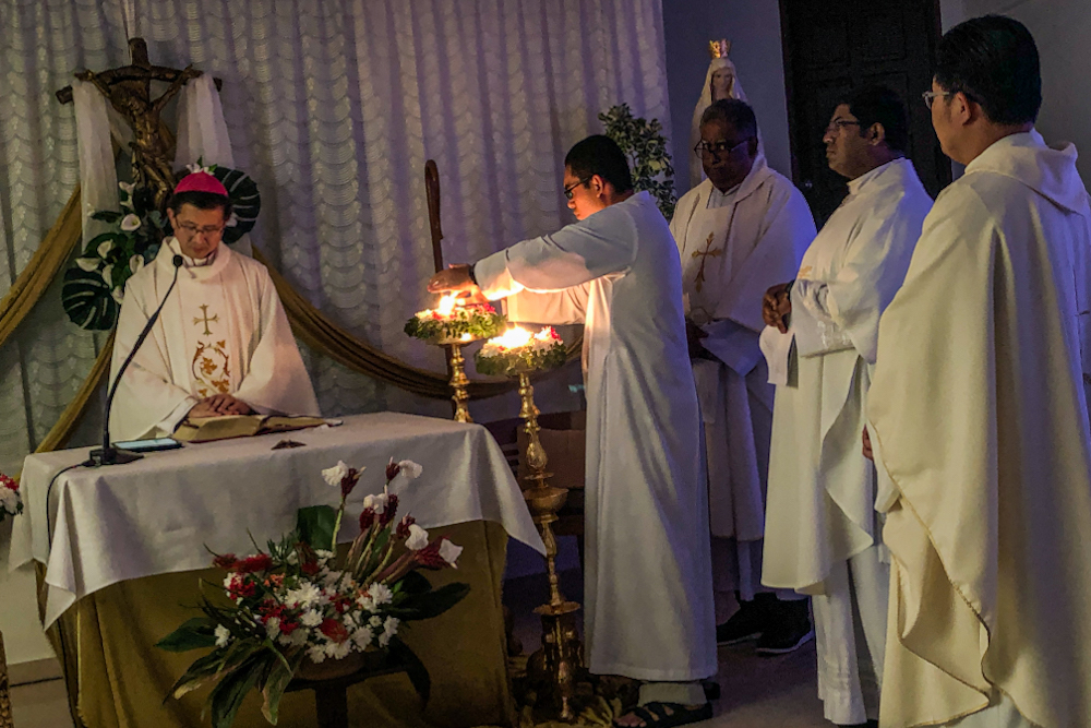 The team from Divine Mercy Church going through preparations before the Easter Vigil livestream on April 11, 2020. ― Picture by Hari Anggara.