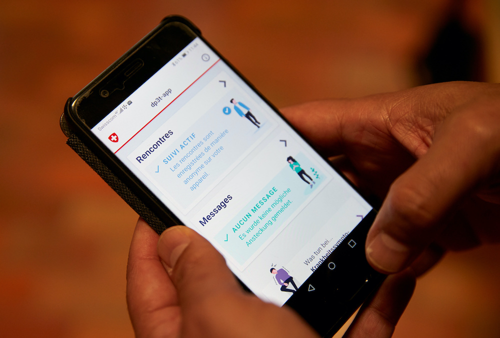 Alfredo Sanchez, project manager at the Swiss Federal Institute of Technology, shows the usage of the contact tracking application, using Bluetooth at the Chamblon barracks, Switzerland April 30, 2020. u00e2u20acu201dReuters picnnn