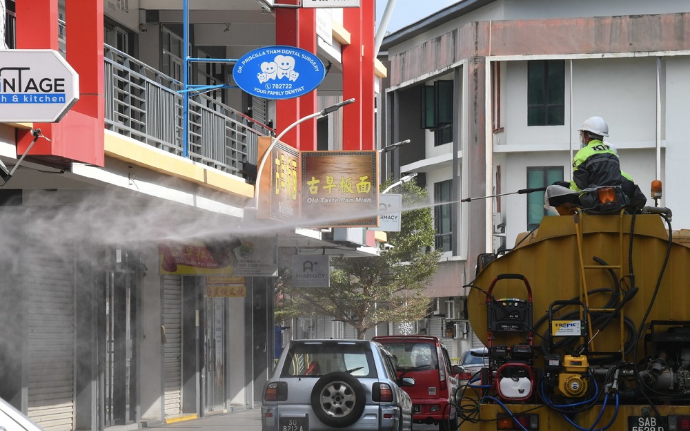 nPenampang District Council workers spray disinfectant at public spaces in Penampang, Sabah April 13, 2020. u00e2u20acu2022 Bernama pic