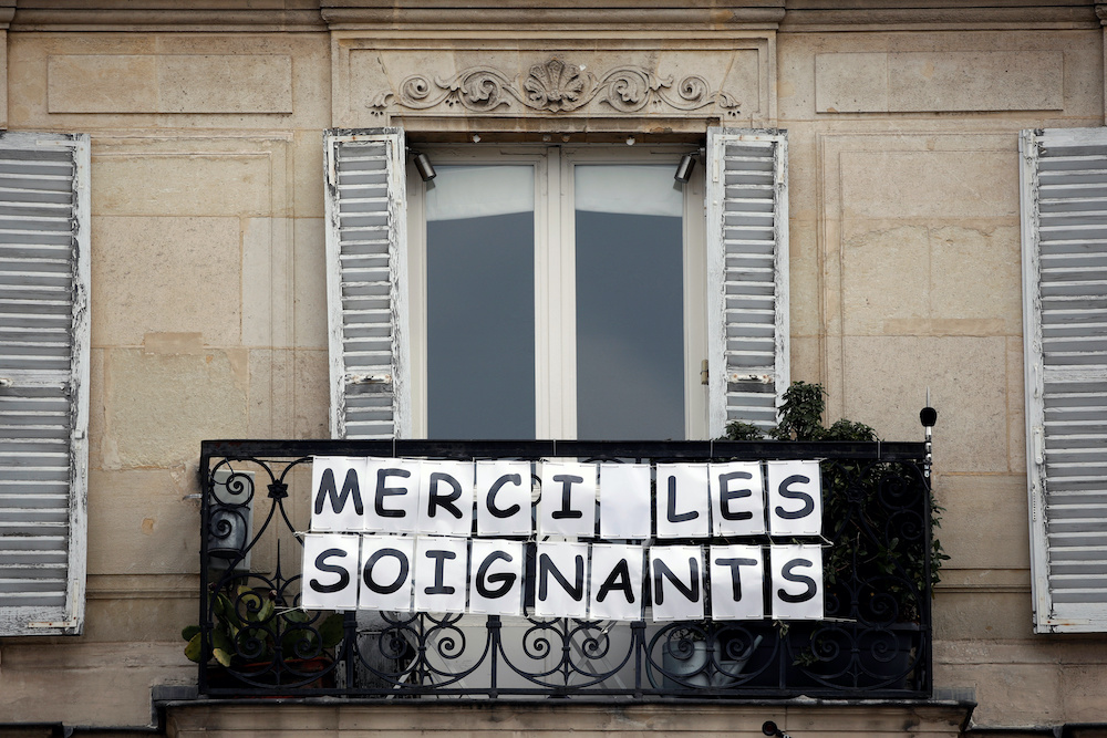 A banner that reads u00e2u20acu02dcThanks to the medical staffu00e2u20acu2122 is seen on a balcony to support caregivers and workers, as lockdown is imposed to slow the rate of the coronavirus disease in Neuilly-sur-Seine, near Paris, France, April 17, 2020. u00e2u20acu201d Reuters pic
