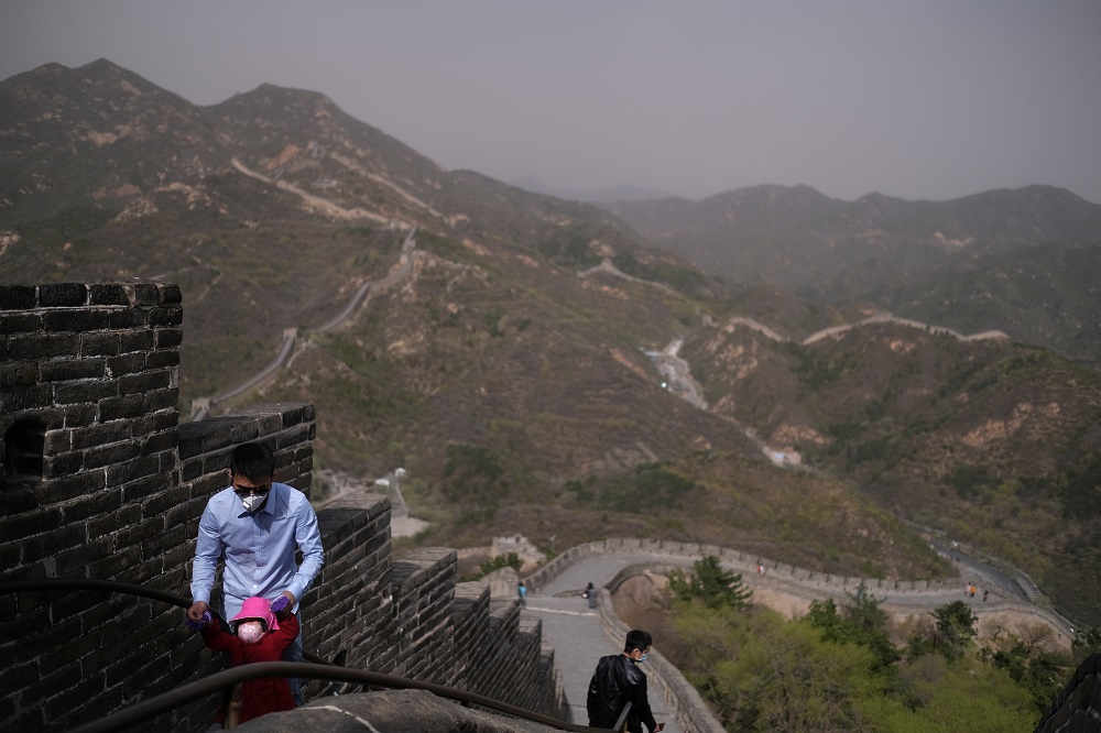 Visitors wearing face masks, following the coronavirus disease outbreak, walk along a section of the Great Wall in Badaling in Beijing April 24, 2020. u00e2u20acu2022 Reuters pic