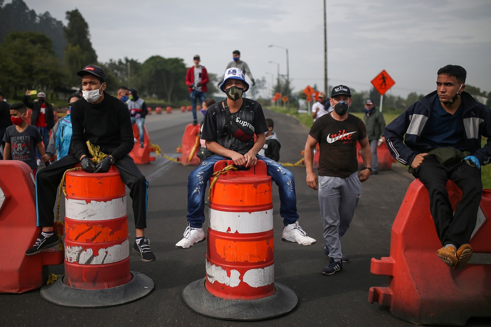 Venezuelan migrants wearing face masks participate in a protest against the blockade of buses that they hired to reach the Colombian-Venezuelan border, amid the outbreak of the coronavirus disease in Bogota April 29, 2020. u00e2u20acu2022 Reuters pic