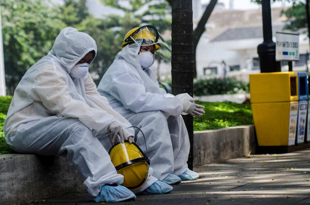 Medical officers rest during a rapid test amid the spread of coronavirus disease outbreak in Bandung, West Java province, Indonesia, April 4, 2020 in this photo taken by Antara Foto. u00e2u20acu2022 Handout via Reuters