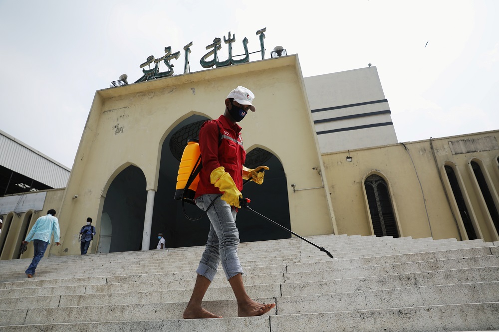 A volunteer sprays disinfectant in the Baitul Mukarram National Mosque before Friday prayer amid concerns over the coronavirus disease outbreak in Dhaka, Bangladesh April 3, 2020. u00e2u20acu2022 Reuters pic