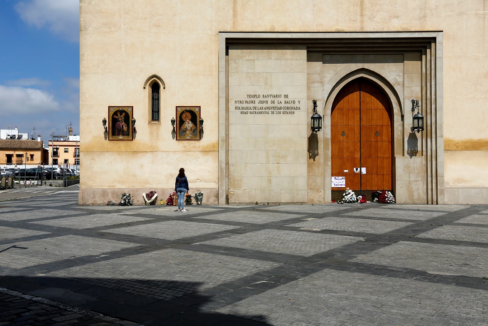 A woman prays outside of Los Gitanos church, where people make floral offerings after the procession was cancelled due to the coronavirus disease outbreak in the Andalusian capital of Seville April 10, 2020. u00e2u20acu2022 Reuters pic