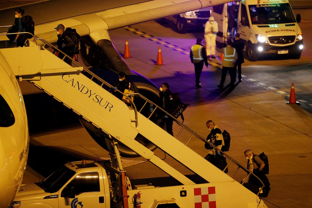 Australian and New Zealand passengers from Australian cruise ship Greg Mortimer board an Airbus A340-300 aircraft for their repatriation at the airport in Montevideo, Uruguay April 11, 2020. u00e2u20acu2022 Reuters pic