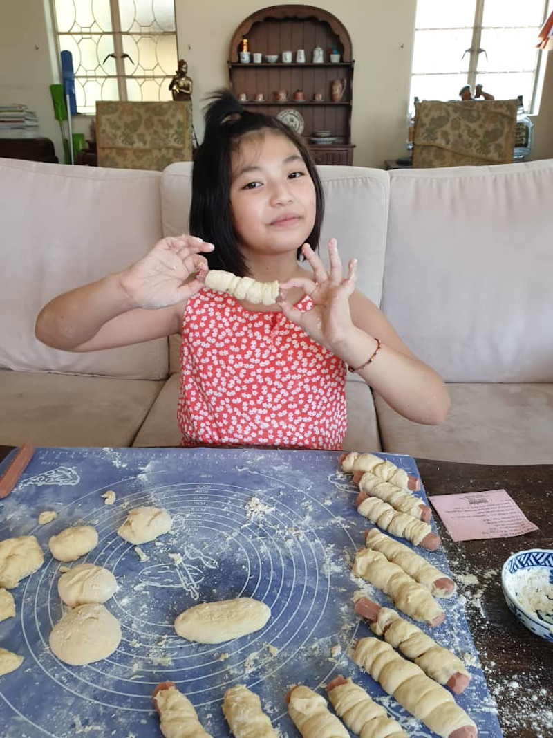 Ooi demonstrates how to make sausage buns at home. — Picture courtesy of Christina Cheng