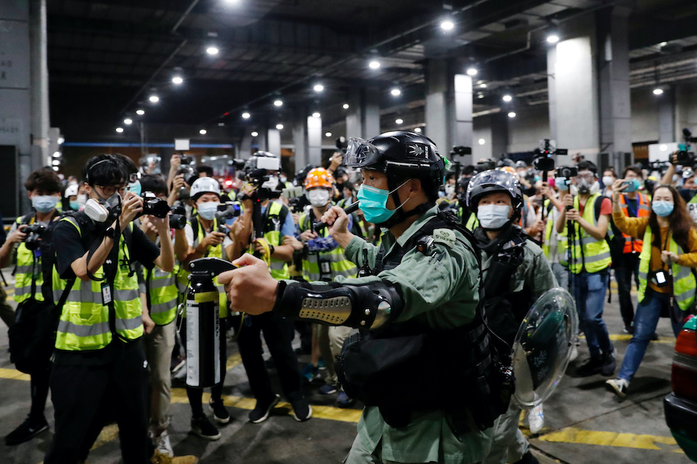 File photo of a riot police holds a pepper spray as he tries to disperse anti-government protesters after a vigil to mourn studentu00e2u20acu2122s death, in Hong Kong, China March 8, 2020. u00e2u20acu201d Reuters picnn