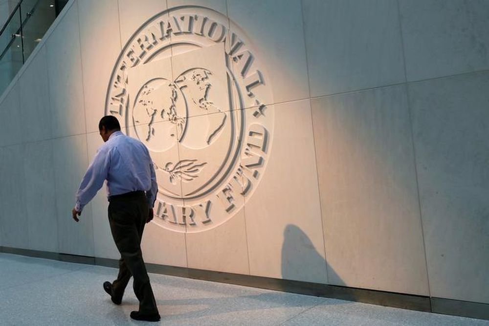 A man walks past the International Monetary Fund (IMF) logo at its headquarters in Washington, US, May 10, 2018. u00e2u20acu201d Reuters pic