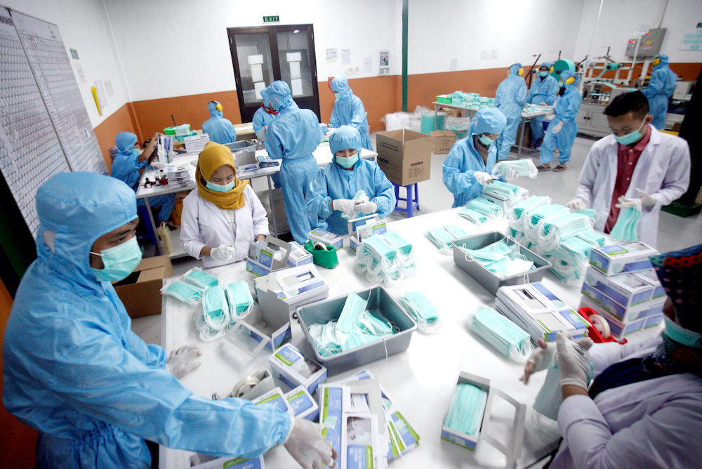 Employees make protective face masks at a factory, amid coronavirus disease (Covid-19) outbreak in Gunung Putri, Bogor, near Jakarta April 15, 2020. u00e2u20acu2022 Reuters pic