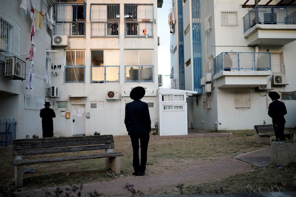 Jewish worshippers stand apart as they practice social distancing in keeping with government restrictions aimed at halting the spread of the coronavirus disease (Covid-19) as they pray in Ashdod, Israel April 1, 2020. u00e2u20acu201d Reuters picnn