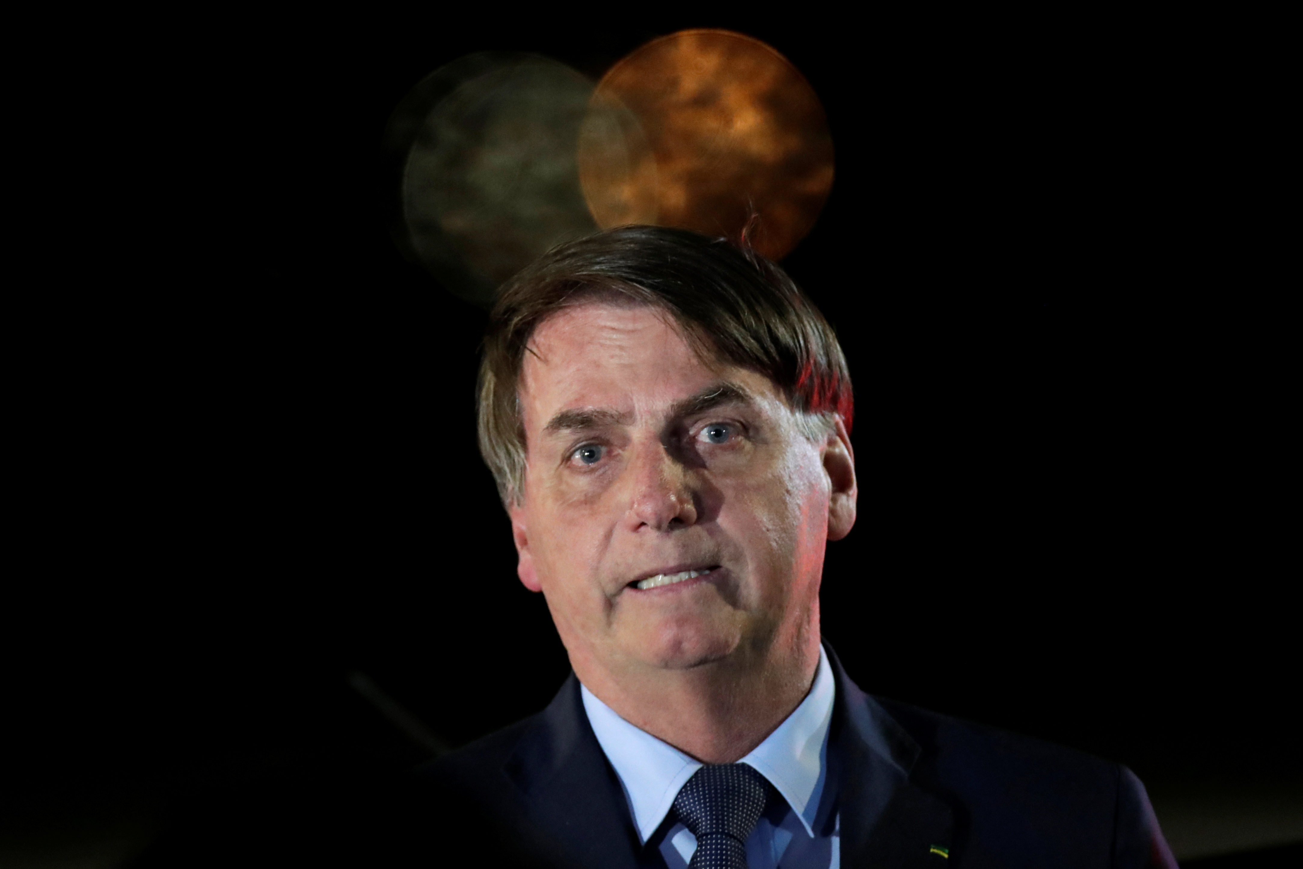 Brazilu00e2u20acu2122s President Jair Bolsonaro reacts while meeting supporters as he arrives at Alvorada Palace, amid coronavirus disease (Covid-19) outbreak, in Brasilia, Brazil, April 1, 2020. u00e2u20acu201d Reuters pic