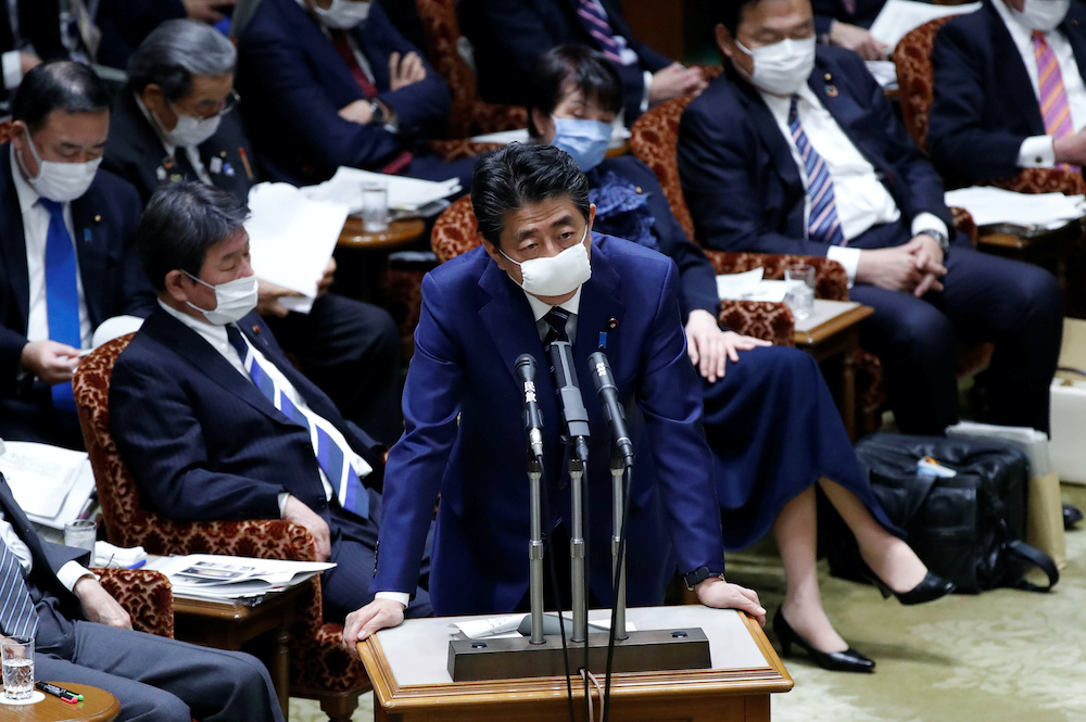 Japanu00e2u20acu2122s Prime Minister Shinzo Abe wears a protective face mask as he attends an upper house parliamentary session, following an outbreak of the coronavirus disease (Covid-19), in Tokyo, Japan April 1, 2020. u00e2u20acu201d Reuters picnn