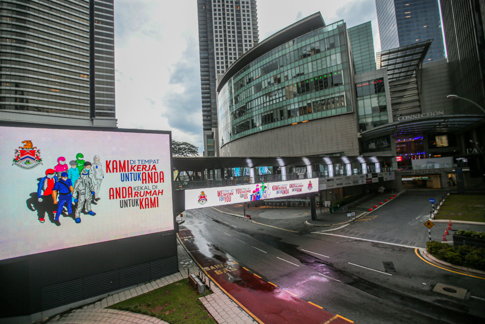 A giant LED board reads u00e2u20acu02dcweu00e2u20acu2122re at work for you, you stay home for usu00e2u20acu2122 near the Pavilion pedestrian bridge during the third phase of the movement control order April 16, 2020. u00e2u20acu201d Picture by Hari Anggara