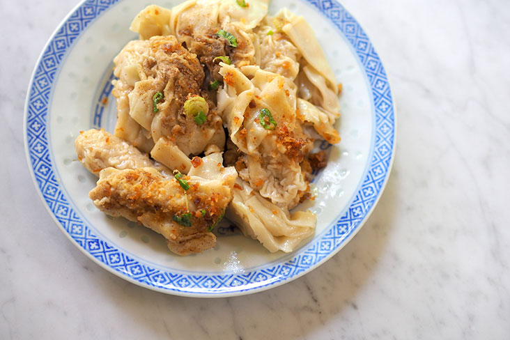 Order a plate of 'bien niuk' that is a contrast of textures with a substantial filling of mince pork and silky dough sheets