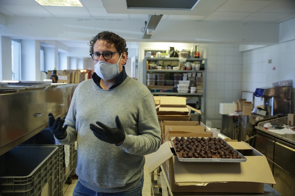 Brussels-based chocolate maker Laurent Gerbaud handles chocolates in his workshop in Brussels on April 9, 2020, during a lockdown in Belgium to curb the spread of the Covid-19 pandemic. — AFP pic