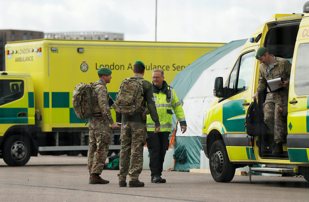 Military personal talks to medical staff at NHS Nightingale hospital as the spread of the coronavirus disease (Covid-19) continues, London, Britain, April 2, 2020. u00e2u20acu201d Reuters pic