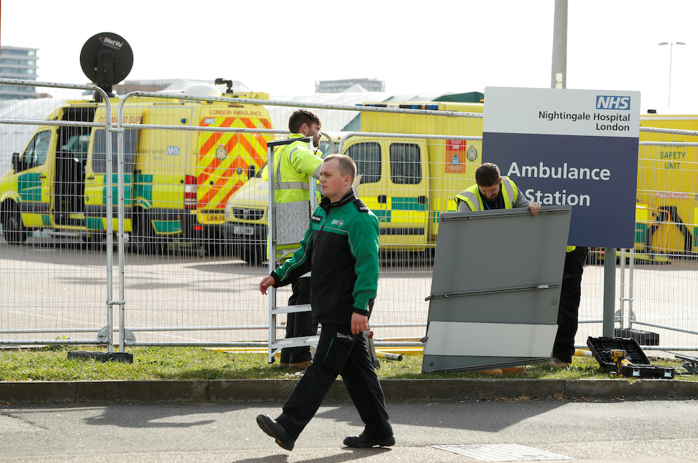 Staff put up some signs at the NHS Nightingale Hospital as the spread of the coronavirus disease (Covid-19) continues, London, Britain, April 3, 2020. u00e2u20acu201d Reuters picnn
