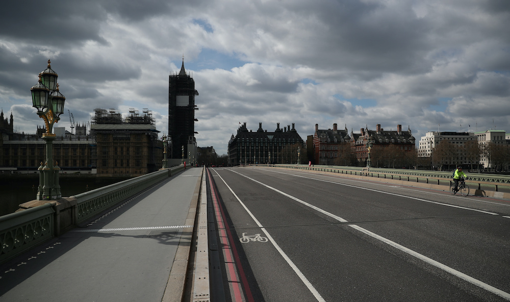 A man cycles across a deserted Westminster Bridge, as the spread of the coronavirus disease (Covid-19) continues, London, Britain, April 3, 2020. u00e2u20acu201d Reuters pic