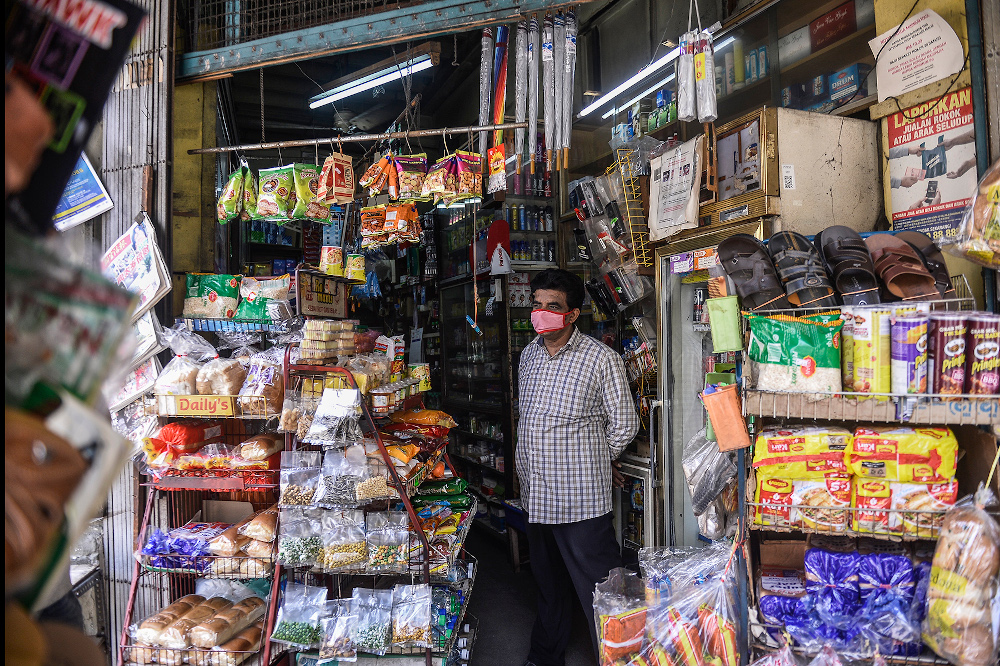 Shopkeeper Mohammad Rafik operates Allapitchy grocery store as usual during movement control order (MCO) in Jalan Tunku Abdul Rahman, Kuala Lumpur April 16, 2020. u00e2u20acu201d Picture by Miera Zulyana