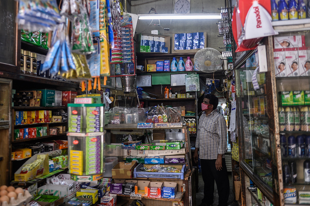 Shopkeeper Mohammad Rafik operates Allapitchy grocery store as usual during movement control order (MCO) in Jalan Tunku Abdul Rahman, Kuala Lumpur April 16, 2020. u00e2u20acu201d Picture by Miera Zulyana