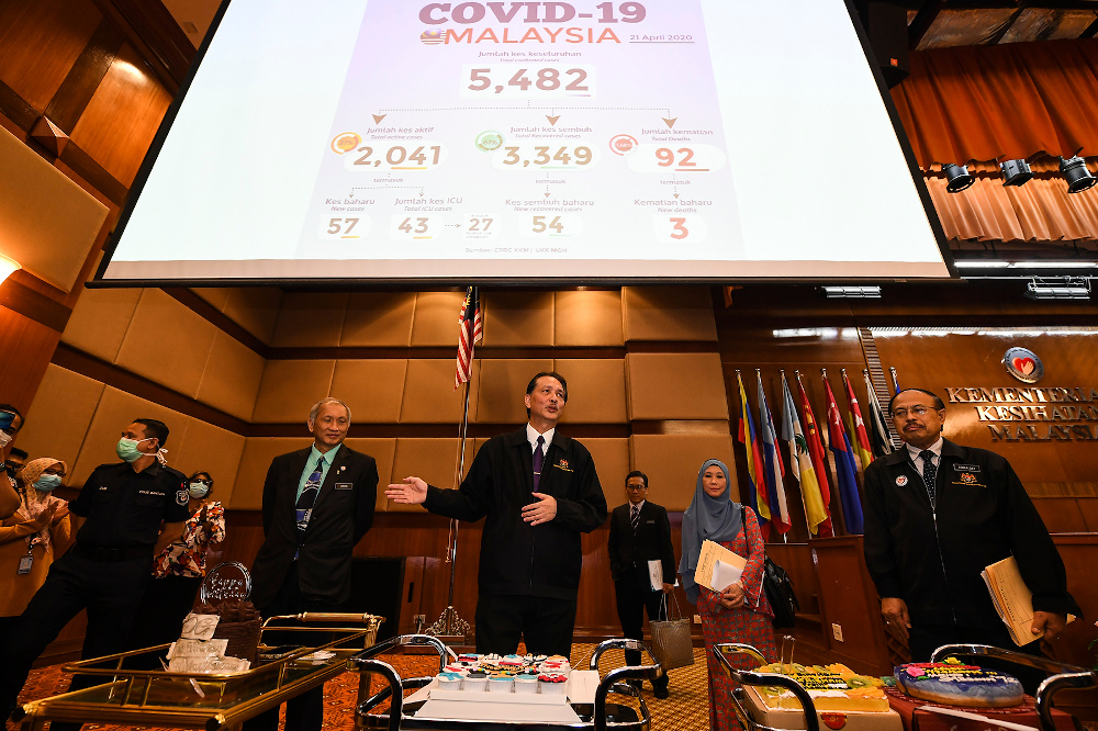 Members of the media celebrating Health director-general Datuk Seri Dr Noor Hishamu00e2u20acu2122s 57th birthday after a press conference in Putrajaya April 21,2020. u00e2u20acu201d Picture by Miera Zulyanan