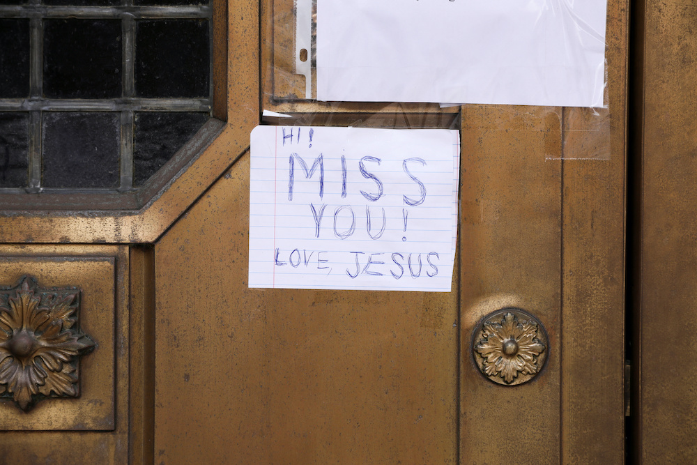 A sign at the door of the closed Saint Anselm Church is seen during the outbreak of coronavirus disease (Covid-19) in the Brooklyn borough of New York, US, April 10, 2020. ― Reuters pic