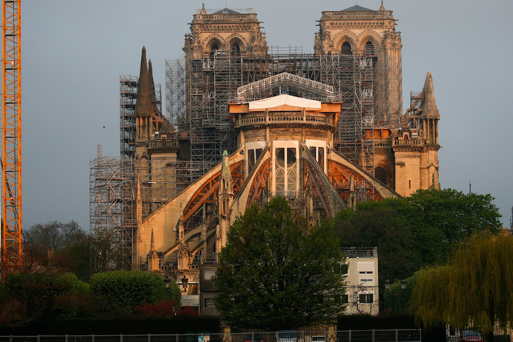 A view shows the restoration work at Notre Dame Cathedral, which was damaged in a devastating fire almost one year ago, in Paris ahead of Easter celebrations to be held under lockdown imposed to slow the spread of the coronavirus disease (COVID-19) in Fra