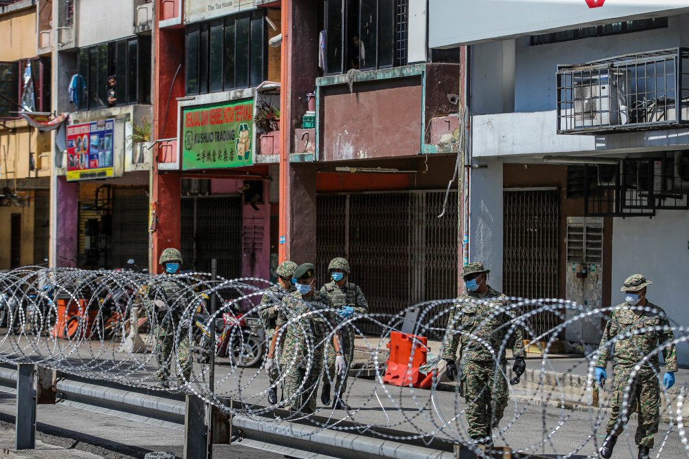 Malaysian army personnel patrol the locked down area of Selayang wholesale market in Kuala Lumpur April, 21 April 2020. u00e2u20acu201d Picture by Hari Anggara