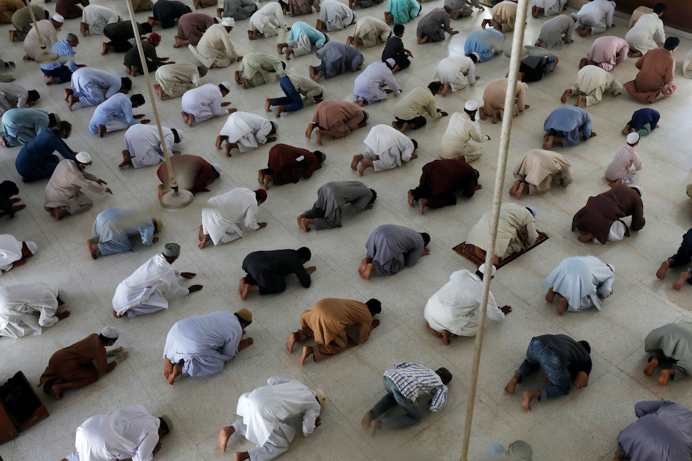 Muslims maintain safe distance as they attend Friday prayer as provincial government limited congregational prayers and ordered to stay home, in efforts to stem the spread of the coronavirus disease, in Karachi, Pakistan April 24, 2020. — Reuters pic