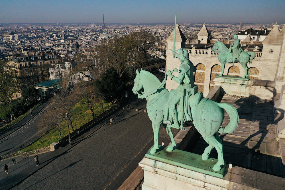 An aerial view shows an almost deserted Butte Montmartre and the Sacre-Coeur Basilica, during a lockdown imposed to slow the spread of the coronavirus disease (Covid-19) in Paris, France April 4, 2020. u00e2u20acu201d Reuters picnn