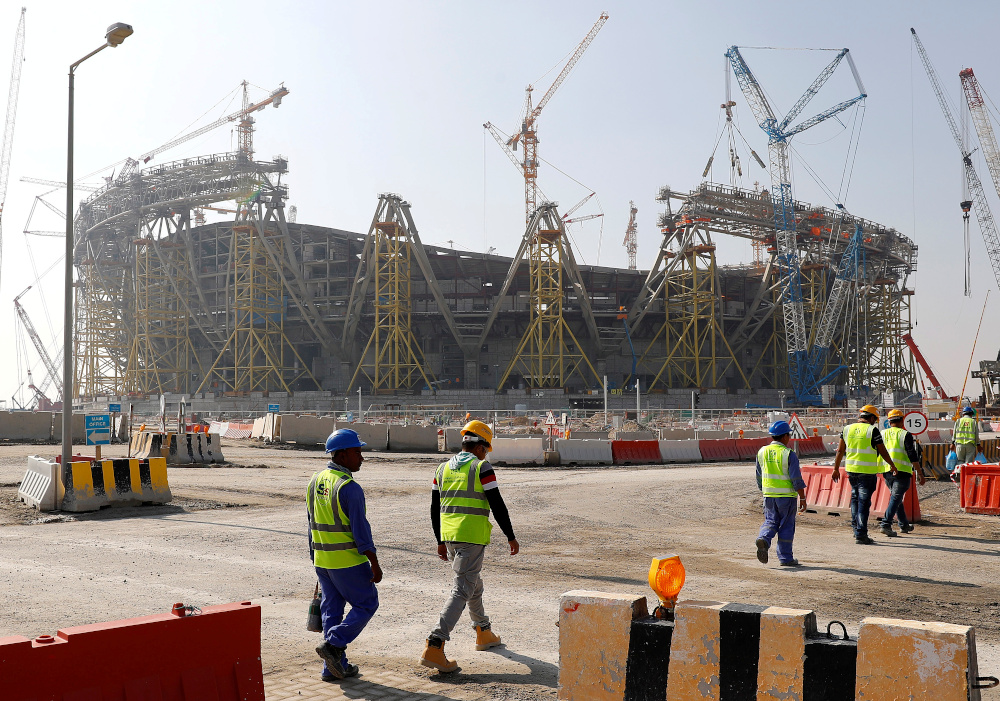 Workers walk towards the construction site of the Lusail stadium which will be build for the upcoming 2022 Fifa soccer World Cup during a stadium tour in Doha, Qatar, December 20, 2019. u00e2u20acu201d Reuters pic 