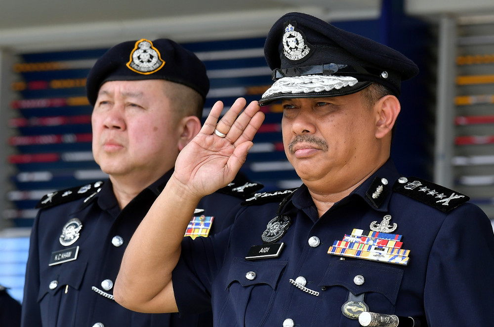 Sarawak Police Commissioner Datuk Aidi Ismail salutes officers and General Operations Force Sarawak Brigade at the Sarawak Brigade headquarters in Kuching, March 2, 2020. u00e2u20acu201d Bernama pic 