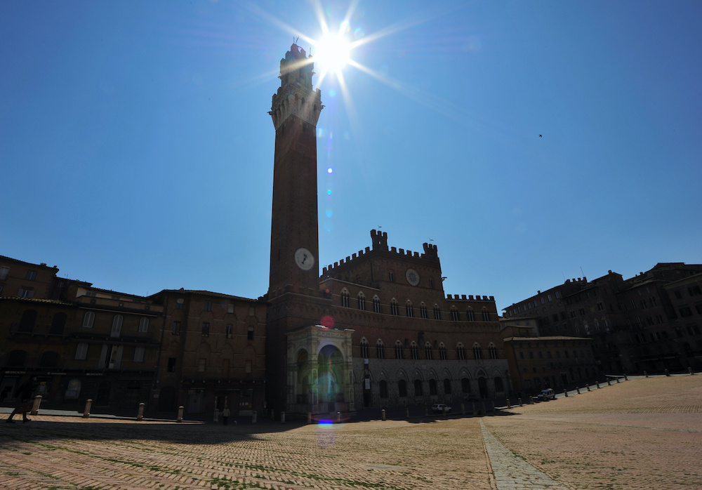 Grass is seen on the Piazza del Campo, that hosts the Palio di Siena horse race twice a year in the medieval city of Siena, Italy, April 9, 2020. u00e2u20acu201d Reuters pic