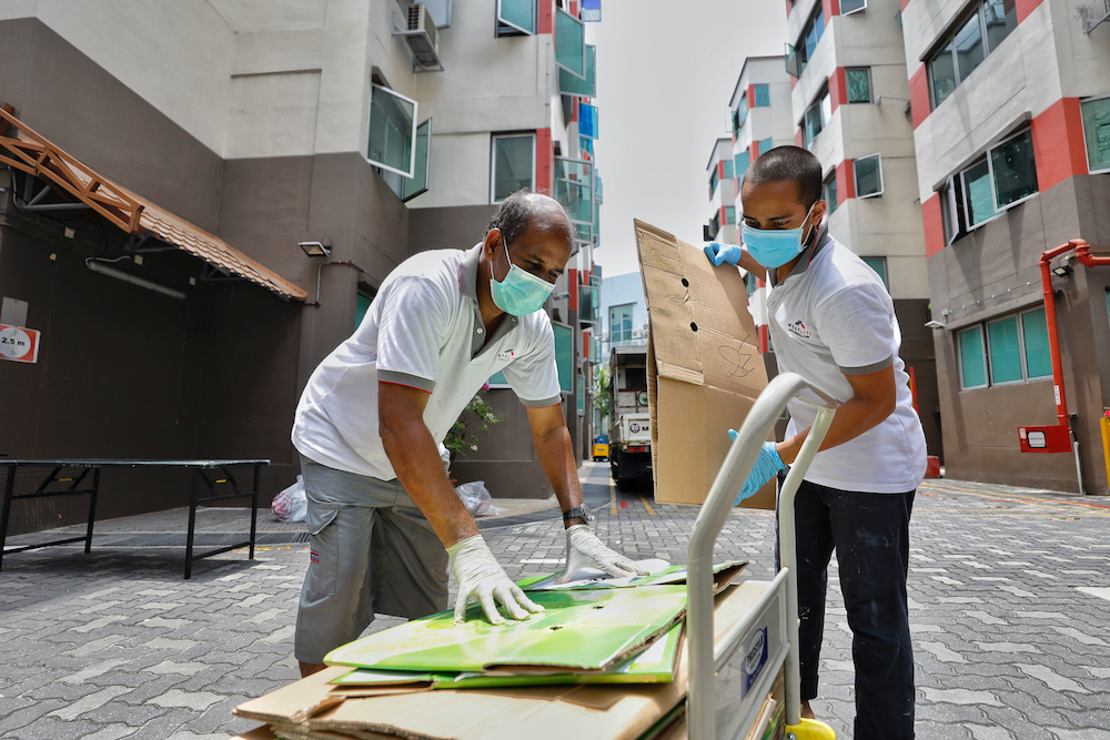 Cardboard is cleared after lunch delivery at Westlite dormitory during the coronavirus disease (Covid-19) outbreak in Singapore, April 10, 2020 in this picture obtained from social media. u00e2u20acu2022 Reuters picnnnn