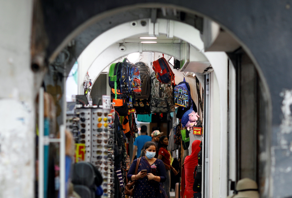 People wearing protective face masks walk a Singaporeu00e2u20acu2122s Changi Airport, following the outbreak of the coronavirus disease (Covid-19) March 30, 2020. u00e2u20acu201d Reuters pic